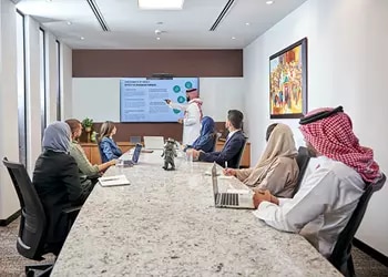 A professional team collaborates in a premium Servcorp boardroom in Saudi Arabia, utilizing state-of-the-art meeting facilities to drive business success.