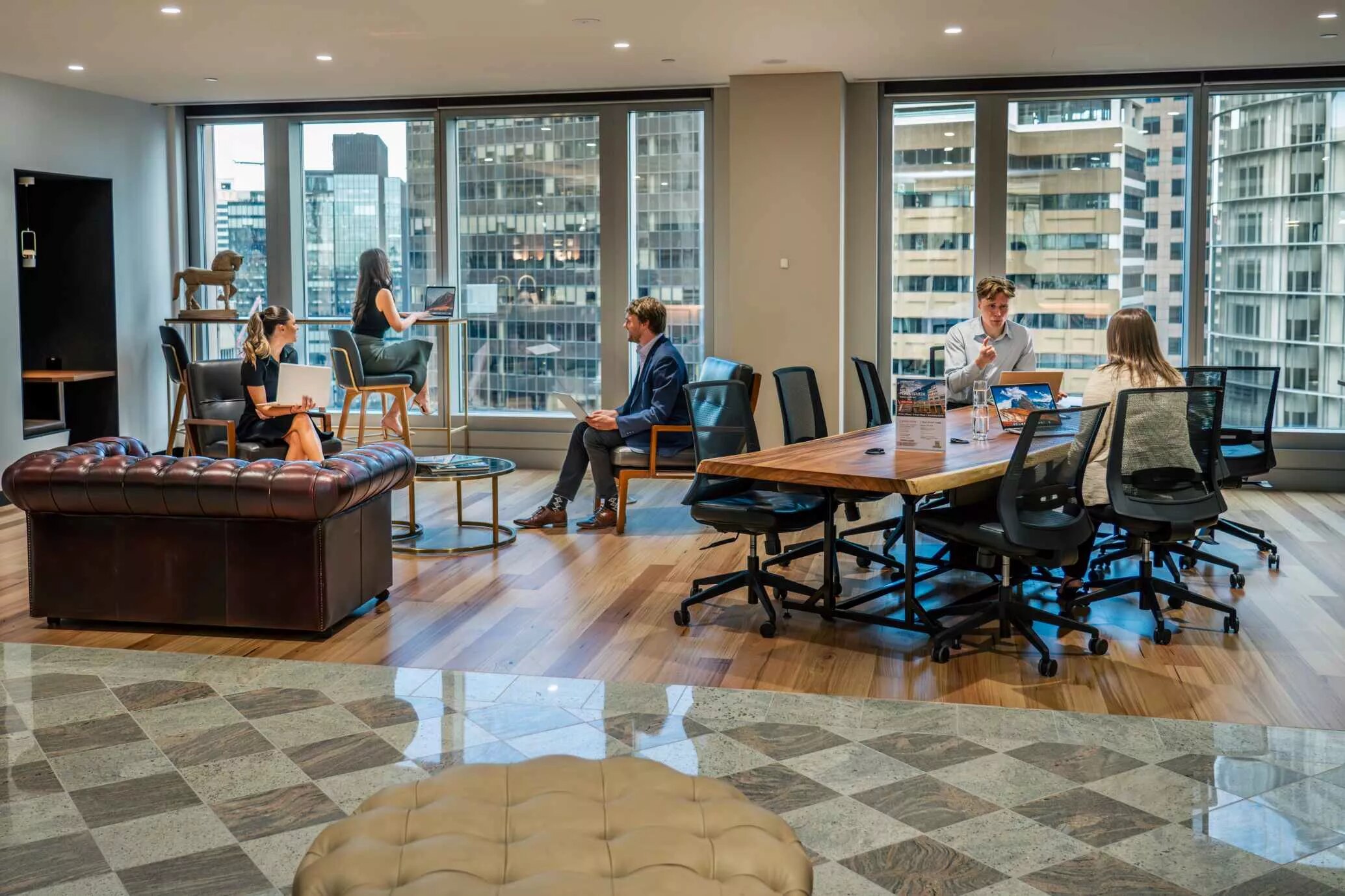 People enjoying their time in a modern coworking space in Chifley Tower with an impressive view