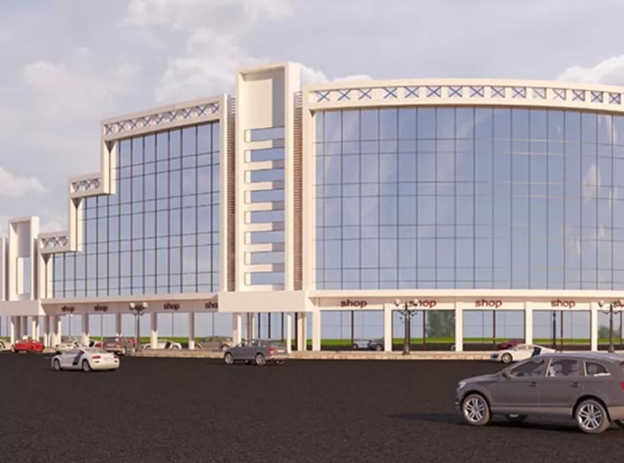 Al Luqmani Business Center in Madinah showcases a striking curved glass façade and contemporary design, offering Servcorp clients a prestigious and modern business address.